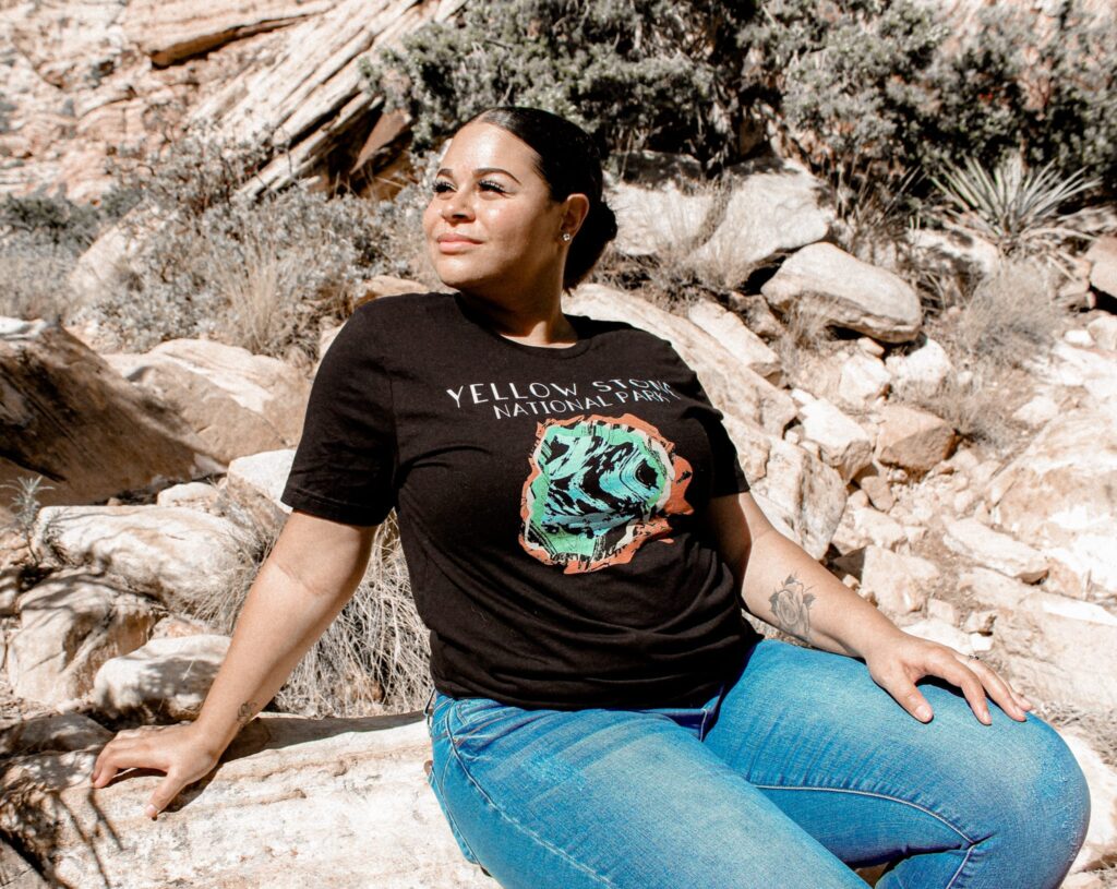 Woman in the mountains, with yellowstone t-shirt
