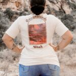 Woman in the mountains, with Canyonlands shirt